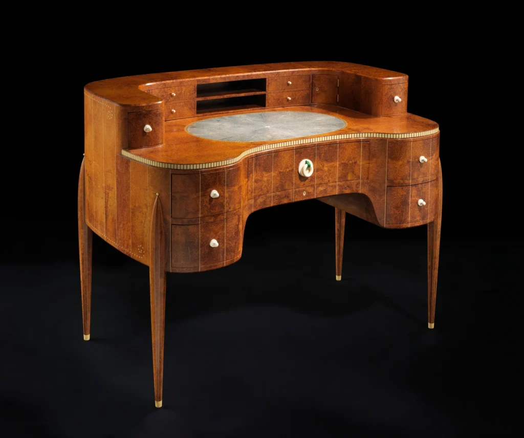 Ruhlmann's Art Deco desk with amboyna veneer, slender legs and ivory details