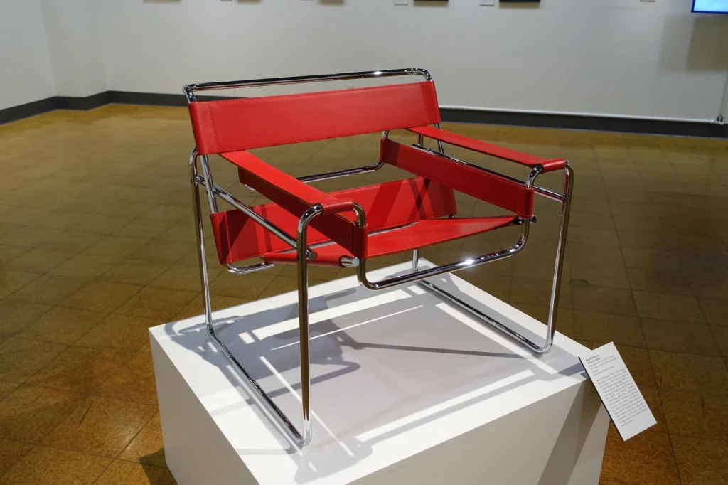 Breuer's armchair with a chrome-plated tubular steel frame and red leather straps