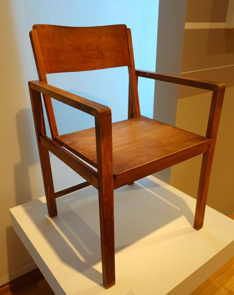 Clean-lined Bauhaus standard armchair in polished wood and plywood